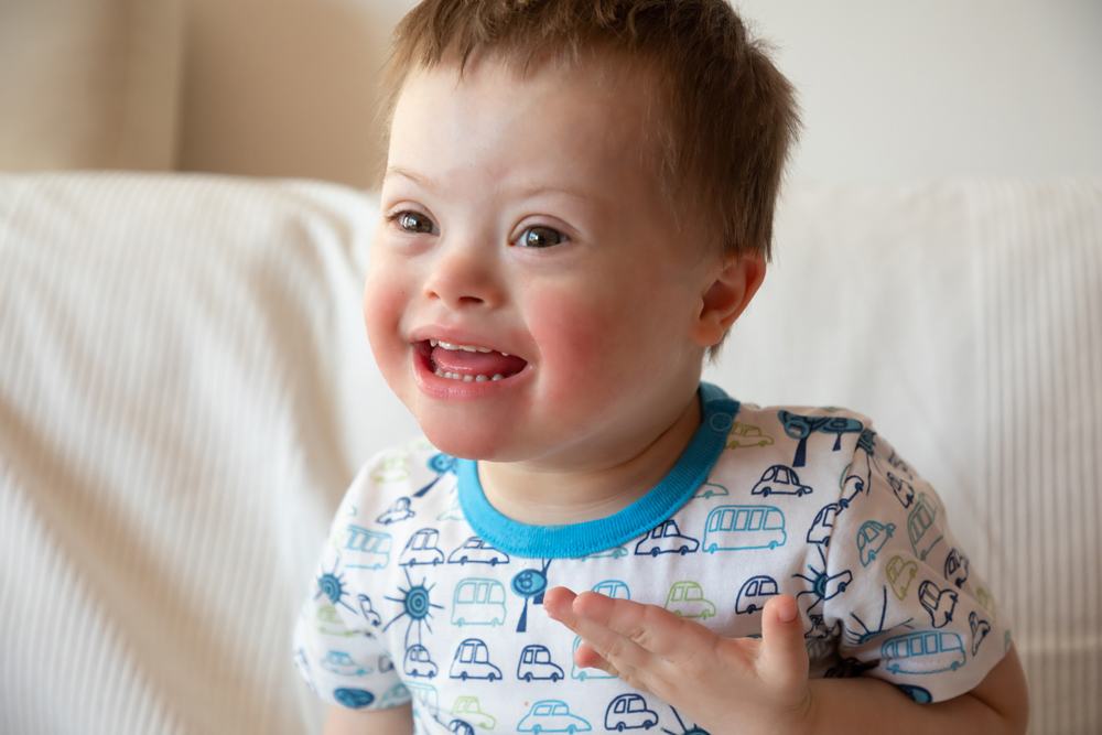 Portrait of cute small boy with Down syndrome Kinder & Familien 5